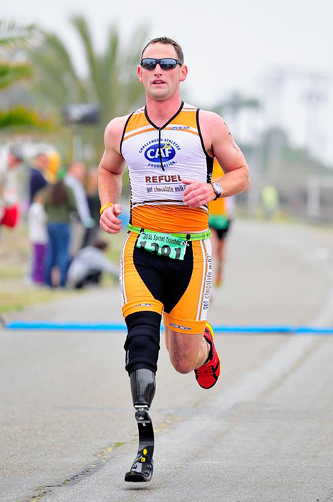 Eric McElvenny running in Ironman 70.3 Oceanside