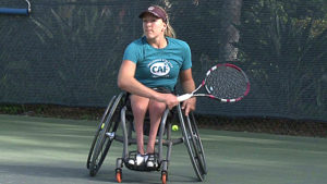 lady playing wheelchair tennis