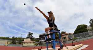 Athlete using a throwing chair in the High School Adaptive Sports Program
