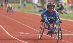 Girl in Wheelchair at Track Race - CAF Impact