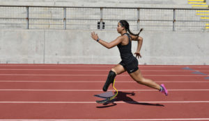 CAF athlete Ella Rodriguez sprinting on the track