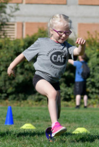 Kenasyn Bird running obstacle course