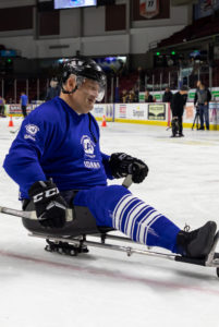 Kevin Holtry playing sled hockey