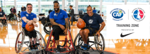 Steve Serio Isaiah Pead and Trooper Johnson at Nike Wheelchair Basketball Clinic pose for a photo