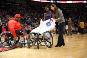 Rebecca Miller presenting Per4Max chair to Ke’Vaughn LaVigne 600x400