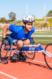 Mikale Herivaux racing on handcycle