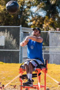 Mikale Herivaux throwing weighted ball