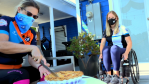 Amy cutting pie with Anna