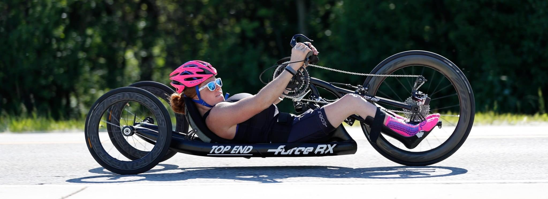 Mary Kate Callahan riding handcycle on road