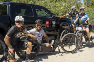 Smoke N Fire Team next to handcycle and Toyota truck