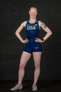 Portrait of Kym Hightower in Team USA uniform against black backdrop