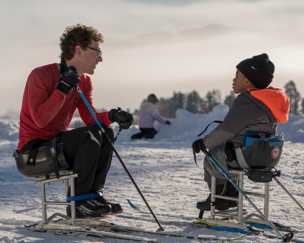 Wilson Dippo with Jackson on a sit ski in the snow