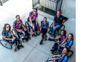 Women's Adaptive Cycling Team sitting in handcycles and wheelchairs