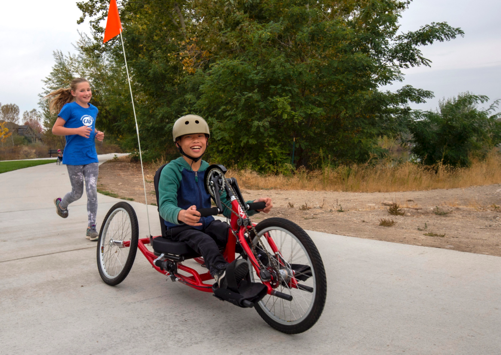 CAF Idaho adaptive youth athletes riding Zipper Handcycles