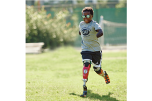 Chase Merriweather running on prosthesis in grass
