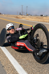 Craig Cornwall handcycling on paved road