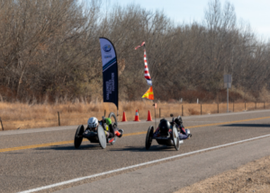 Handcyclists racing on pavement