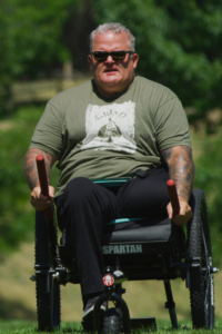 Kevin Holtry in GRIT Chair with greenery in background