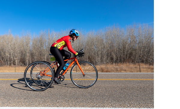 CAF Idaho athlete Ellie Kennedy riding bike on road