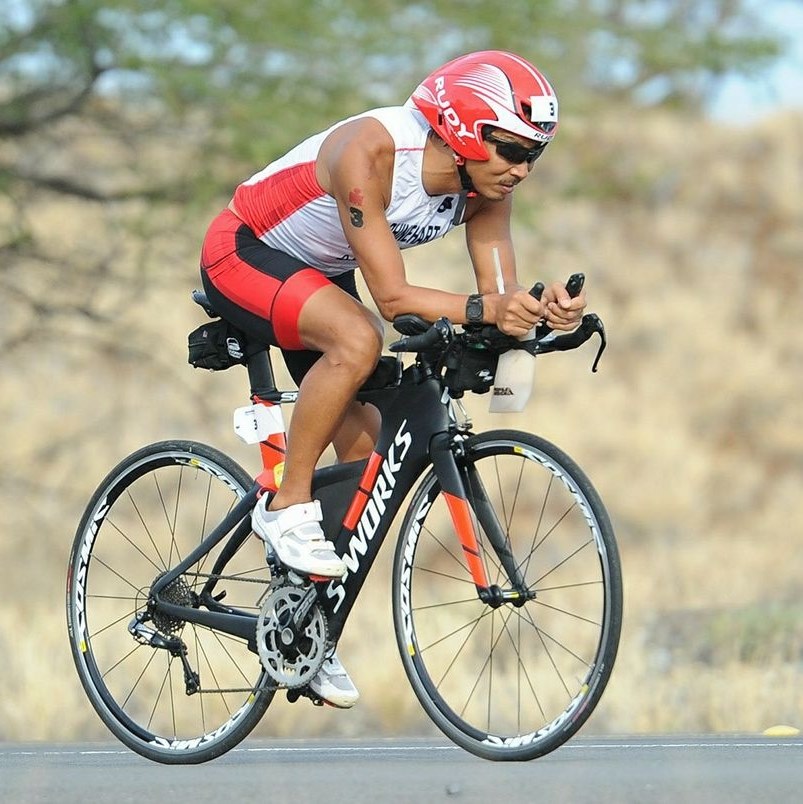 Kevin Rhinehart riding on a bicycle