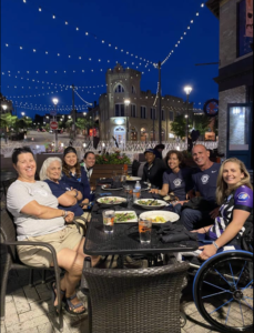 Women's Adaptive Cycling Team sitting at table for team dinner