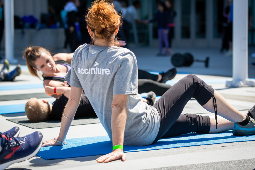 Woman wearing grey Accenture shirt at 2019 Inclusive Workout