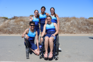 Sammy Rhodes standing next to Para Tri Camp friends at Fiesta Island