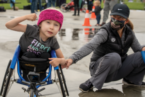 Clara Longoria at Wheelchair Racing Clinic in Idaho sitting in racing wheelchair
