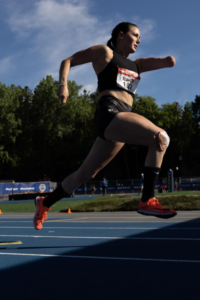 Dani Aravich running on track