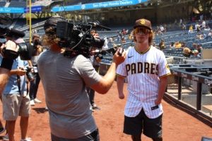 Landis Sims with Filmmaker Eric Cochran filming at Petco Park