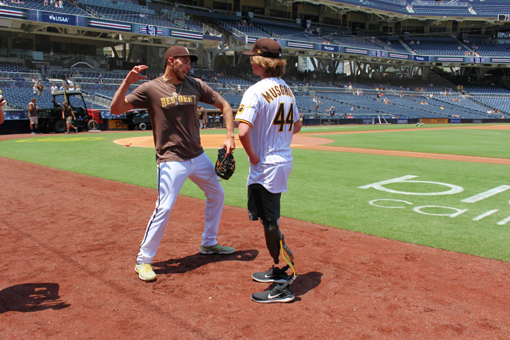 Padres-Joe-Musgrove-with-Landis-Sims-at-Petco-Park-field-giving-throwing-advice