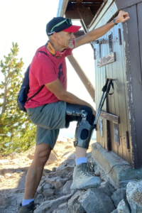 Scott Pederson standing with foot on rock