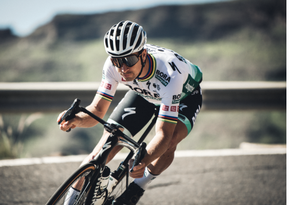 Pauline Ballet cycling on road bike wearing 100 Percent glasses