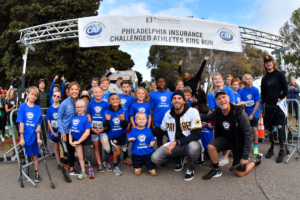 Joe Musgrove with group of kids at starting line of CAF Kids Run