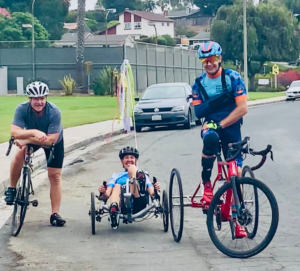 Michelle Pinard riding on handcycle alongside Steven Peace