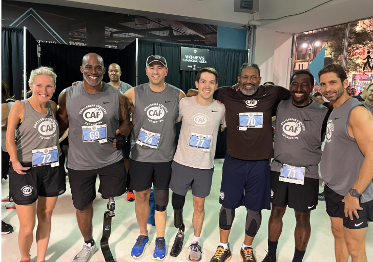 CAF athletes and supporters gather for a group selfie before the Empire State Building Run-Up, smiling and celebrating together.