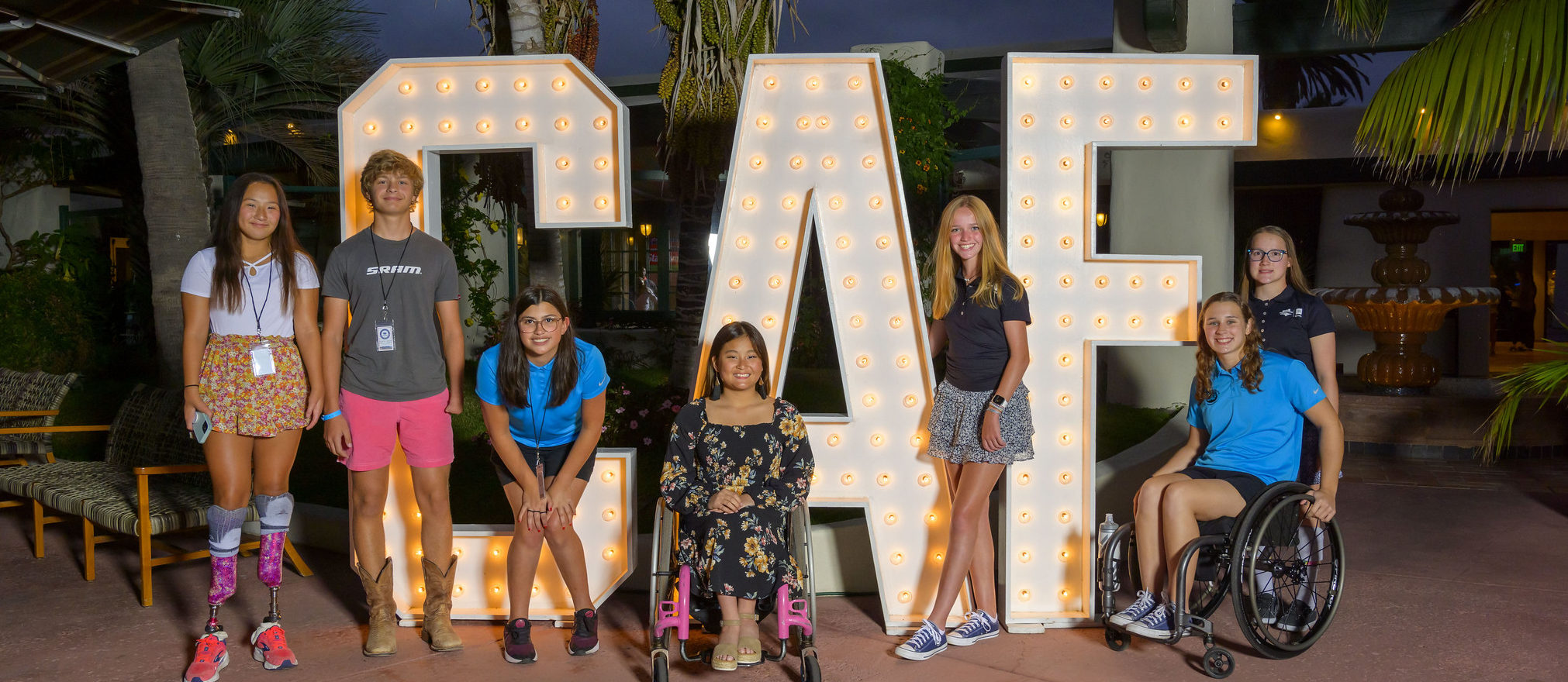 Children at CCC Weekend standing in front of large CAF letters