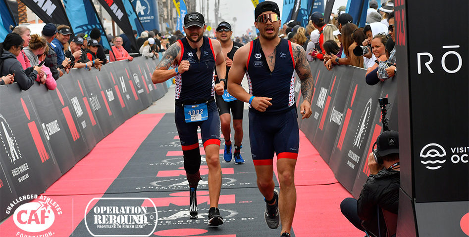 IRONMAN 70.3 male runners crossing the finish line. 