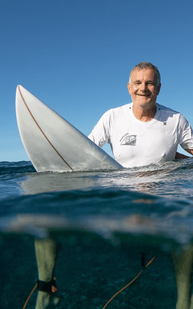 Jack Burger on surfboard in water
