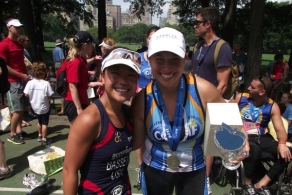 Athletes and supporters gather near the finish line at the Challenged Athletes Foundation San Diego Triathlon Challenge, celebrating participation, community, and inclusion.