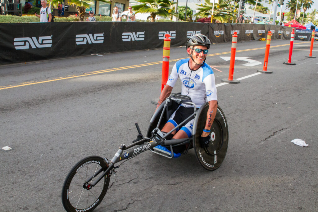Glenn Hartrick pushing his racing wheelchair backwards at the Ironman World Championship in Kona