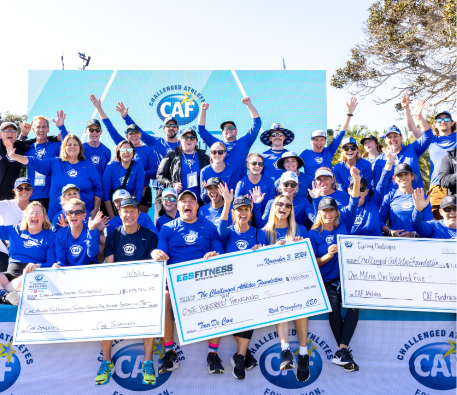 CAF staff on stage in blue CAF shirts with 3 checks at SDTC