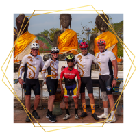 Group of cyclists standing together during a CAF global cycling adventure in Thailand