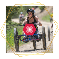 Athlete with a physical disability navigating a trail during a CAF outdoor sports program