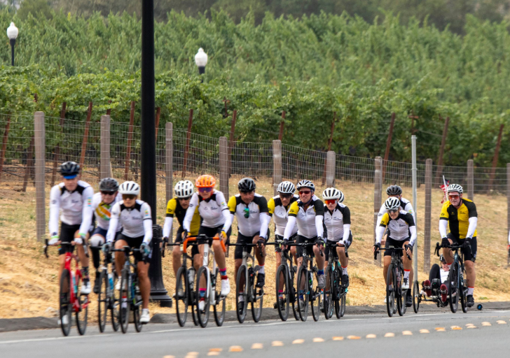 Group of cyclists riding together in california down the coast