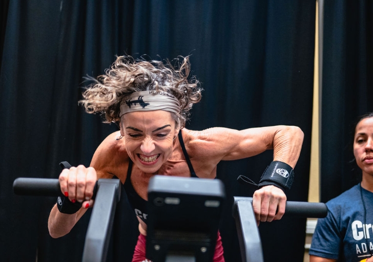 Hannah Webster powers through a rowing workout during competition at the CrossFit Adaptive Games.