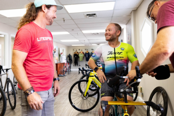 Athlete receiving a professional bike fit on a Quintana Roo bicycle through a Challenged Athletes Foundation cycling program.