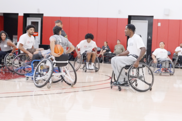 Participants in sports wheelchairs compete during a wheelchair basketball scrimmage at a Southern California adaptive sports clinic supported by the Challenged Athletes Foundation.