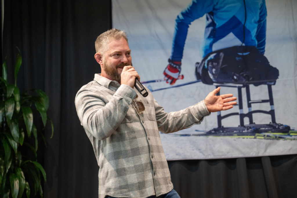 CAF Ambassador Travis Ricks speaking at CAF Idaho event at the Idaho Outdoor Fieldhouse