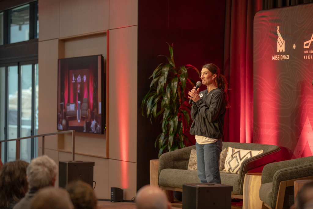 April Rohr speaking at CAF Idaho event at the Idaho Outdoor Fieldhouse
